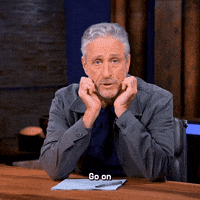 TheProblemWithJonStewart silly goofy listening sarcastic GIF