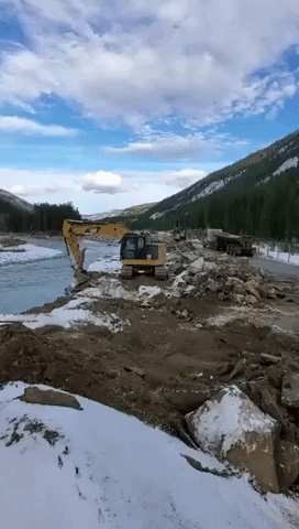 Workers Use Earthmovers to Clear British Columbia Highway Following Devastating Floods