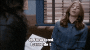 TV gif. Chelsea Peretti as Gina Linetti on Brooklyn Nine Nine sits on a couch and then flops sideways on it like she’s dead. She says, “Oh, I’m so bored. I cannot do it.”
