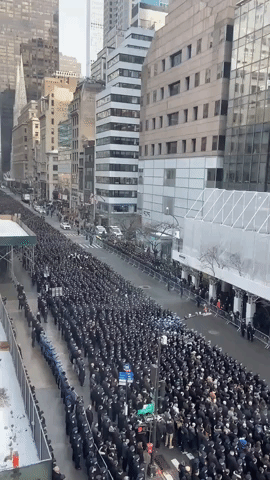 'Blue Wall' of Uniformed Police Honor Slain NYPD Officer in Manhattan