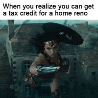 Text gif. Gal Godot as Wonder Woman flies shield first, smashing into a brick building, exploding it into dust. Text, "When you realize you can get a tax credit for a home reno."