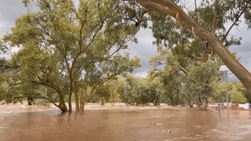 Usually Dry River Overflows During Record Rainfall in Alice Springs
