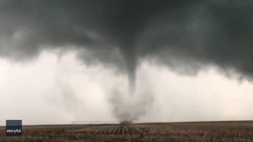 Funnel Cloud Swirls Through Kansas Fields