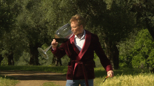 Man enjoying wine in a big glass