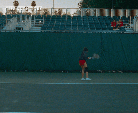 Movie gif. A shot from the movie "Challengers." Tashi Donaldson is on a tennis court, facing away from the camera. She throws her racket to the ground in anger. 