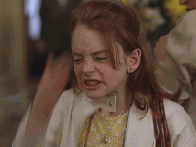Movie gif. Lindsay Lohan as Hallie in The Parent Trap slaps her hand to her forehead and winces in frustration.