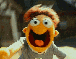 Movie gif. Walter from The Muppets runs towards a shaky camera with his mouth wide open ready to scream, and his puppet arms flailing around. 
