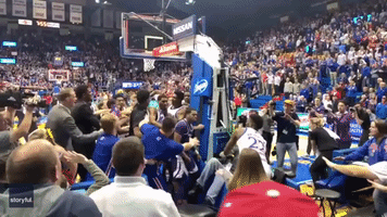 Fan Captures Close-Up of Brawl Between Warring College Basketball Teams