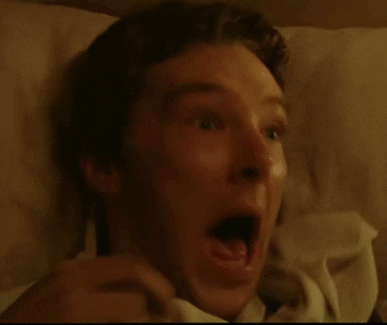 Celebrity gif. Benedict Cumberbatch lays in a bed and screams in terror, trying to hide under his blanket.