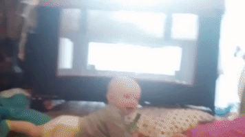 Baby Can't Stop Laughing at New Worm Toy