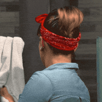 Video gif. Woman dressed up like Rosie the Riveter whips around while drying her hands. Her eyes are widened in complete shock, as if we just said something unbelievable.