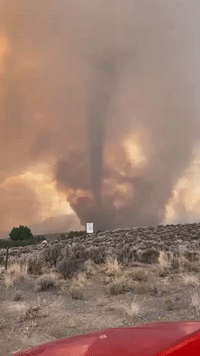 Funnel Cloud Forms Against Backdrop of Uncontained California Wildfire