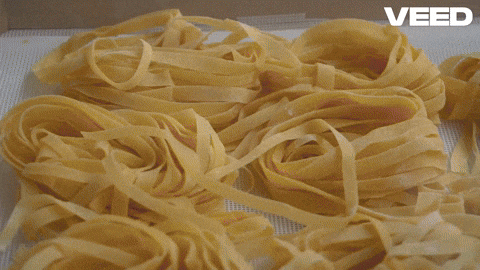 Fresh pasta being made in a pasta machine