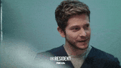 the resident smile GIF