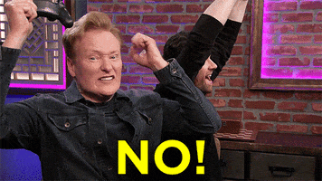 Celebrity gif. An angry Conan O'Brien throws his fists down and screams, “NO!”