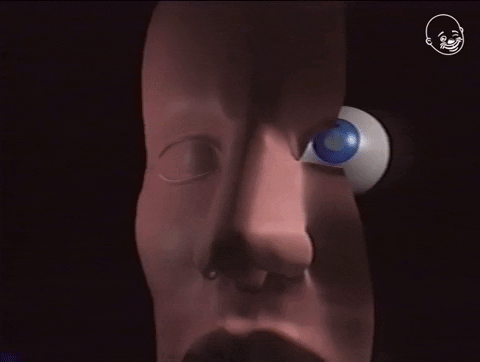 Digital art gif. A 3D video of a face that is split in half to reveal the eye in its socket. It zooms in on the eye and the eye also gets cut in half, so we're able to see the inside of the eyeball and what it's made of.