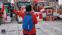 Woman Conducts Air Horn Symphony at Ottawa Convoy Protest