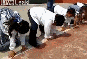 Video gif. Bunch of toddlers are lined up ready to race. They all run but there's a boy who straggles along and when he sees them loop back, he cheats, and comes back with them without reaching the end.