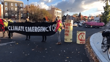 Climate Activists Block Intersection During Rush Hour in Washington