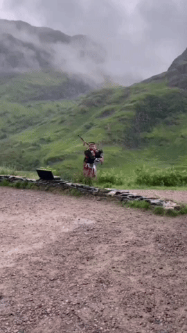 scottish bagpiper wearing tartan in scotland