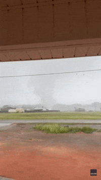 'Oh My God': Debris Flies as Tornado Swirls Close to Homes
