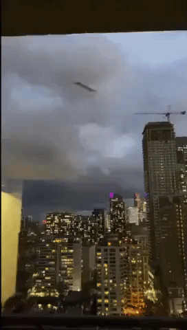 Flying Debris Narrowly Misses Apartment Window During Toronto Windstorm