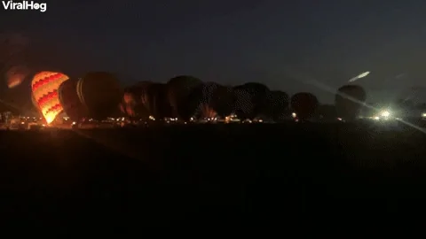 Hot Air Balloons Light up the Night Sky - GIPHY Clips