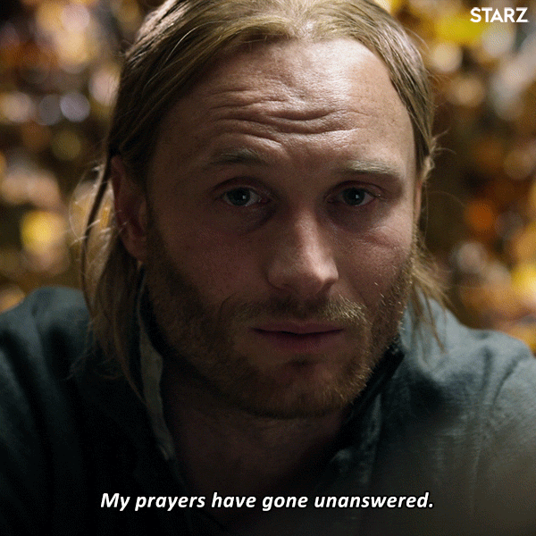 TV gif. Yan Tual as Father Alexandre in Outlander. He looks dejected as he sits and stares blankly before turning to us and saying, "My prayers have got unanswered."