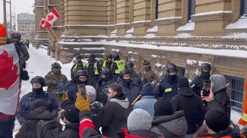 Police and Ottawa Protesters Face Off in Front of Parliament