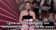 Mikey Madison cradles an Oscar statuette in the crook of one elbow and holds a piece of paper. Breathlessly, she says, “I grew up in Los Angeles, but Hollywood always felt so far away.”