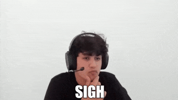 Video gif. Man sits with big headphones on his head. He rubs his chin and then sighs. Text, “Sigh.”