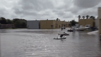 Man Rides Personal Watercraft Over Miami-Area Floodwaters