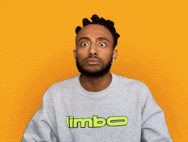 Video gif. A man looks completely shocked, and raises his hands to his head, and we zoom in close as he yells. Text, "OMG."