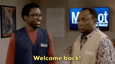 TV gif. From Bob Hearts Abisola, Tony Okungbowa as Kofo smiles at and welcomes Bayo Akinfemi as Goodwin, who appears ambivalent. Text, "Welcome back!"