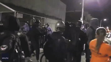 Philadelphia Police Retreat as Demonstrators Hurl Objects at Them