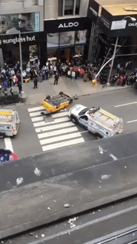 NYPD Flips Crashed Taxi Upright in Manhattan