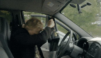 TV gif. William Zabka as Johnny Lawrence gets in his car and repeatedly slams his briefcase on the passenger seat in a fit of anger. He then slams the car door closed.