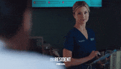 the resident smile GIF