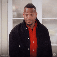 TV gif. Marlon Wayans as Marlon in Marlon jerks his head up straight and raises his eyebrows.