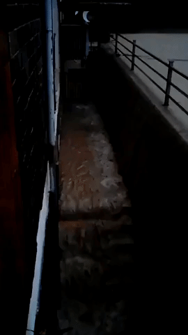 Water Pours From Balcony During Flood in Italy