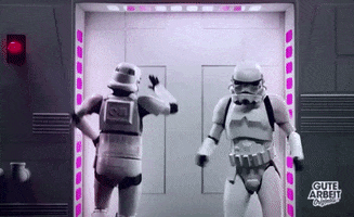 Video gif. Two Stormtroopers dance around on the YouTube Channel Gute Arbeit, backlit by flashing rainbow lights aboard a spaceship.
