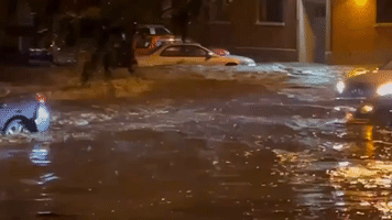 Vehicles Stricken by Flooding in Omaha Streets