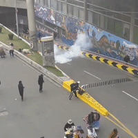 Protesters Dodge Tear Gas During March in La Paz
