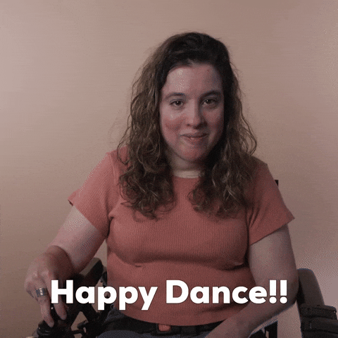 Reaction gif. A Disabled white-presenting Latina woman with cerebral palsy and kinky-curly brown hair, does donuts in her motorized wheelchair. Text, "Happy dance!"