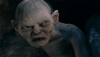 Movie gif. Gollum from "Lord of the Rings" appears devilish and furious, then opens his mouth wide to scream.