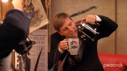 TV gif. Jack McBrayer as Kenneth on 30 Rock pours from a coffee pot into his mouth as he holds a mug underneath.