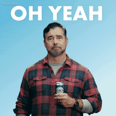 Sponsored gif. Gerald Downey in a red and black plaid shirt nods his head yes in a calm and cool way with a slight smile and expressive eyebrows. Text, "Oh yeah."