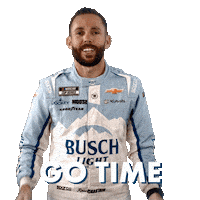 Sponsored sticker gif. NASCAR driver Ross Chastain rubs his hands together and looks from side to side in anticipation. He wears a driver fire suit decorated with many sponsor logos with the largest being the Busch Light beer logo across the center of his abdomen. Text reads, “Go time.”
