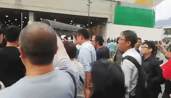 Two Arrested as Hong Kongers Protest Influx of Mainland Tourists Brought by Newly Opened Bridge