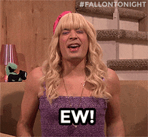 TV gif Jimmy Fallon as Sara on the Tonight Show wears a long blond wig and braces with a tube top The character scrunches her nose in disgust and says Ew